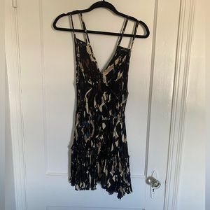 Free people dress with double satraps and side cut outs.